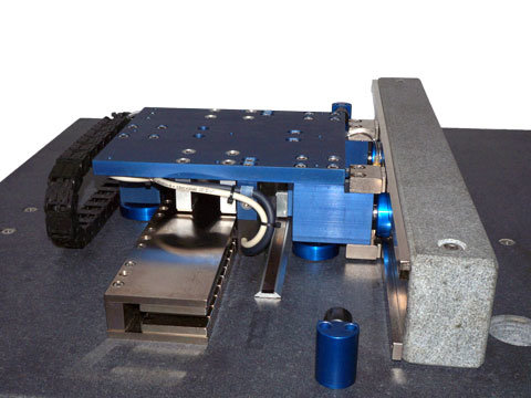 H2W air bearing stage featuring New Way Flat Round Air Bearings.