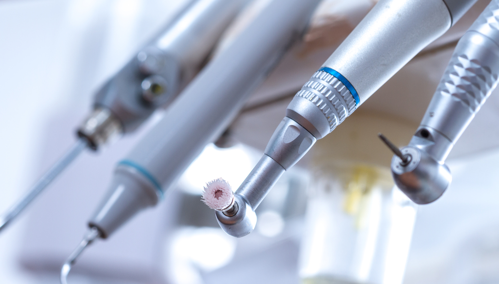 A close-up view of several dental tools.
