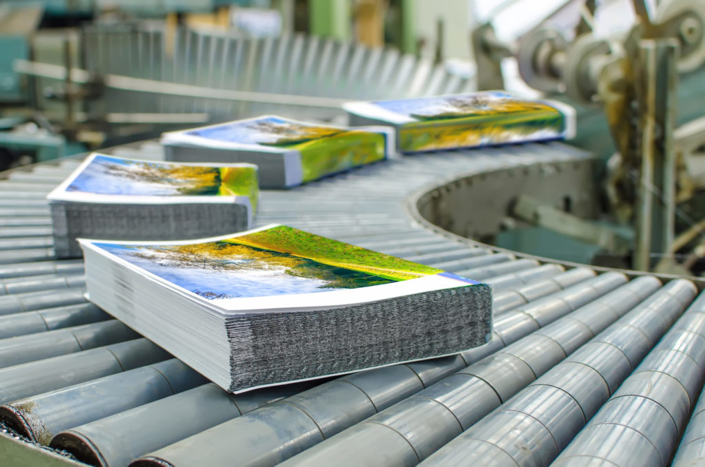 Moving stacks of paper on rollers.