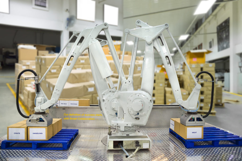 Controller of industrial robotic arm for material-handling and packaging applications in production line manufacturer factory.