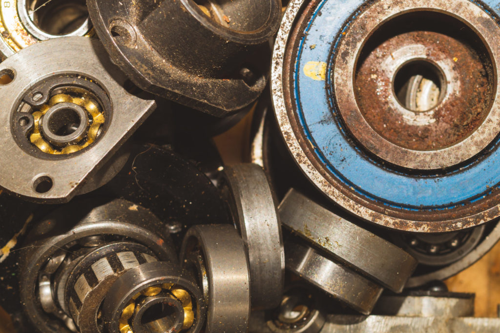 Rusted and dirty ball bearing components.