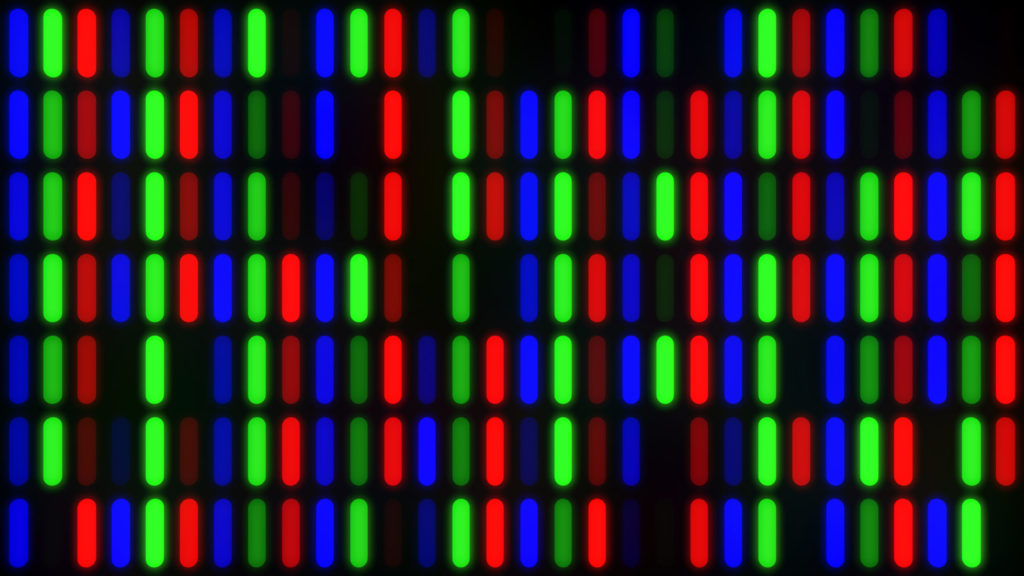 Close-up of LCD screen with colored pixels turned on and off