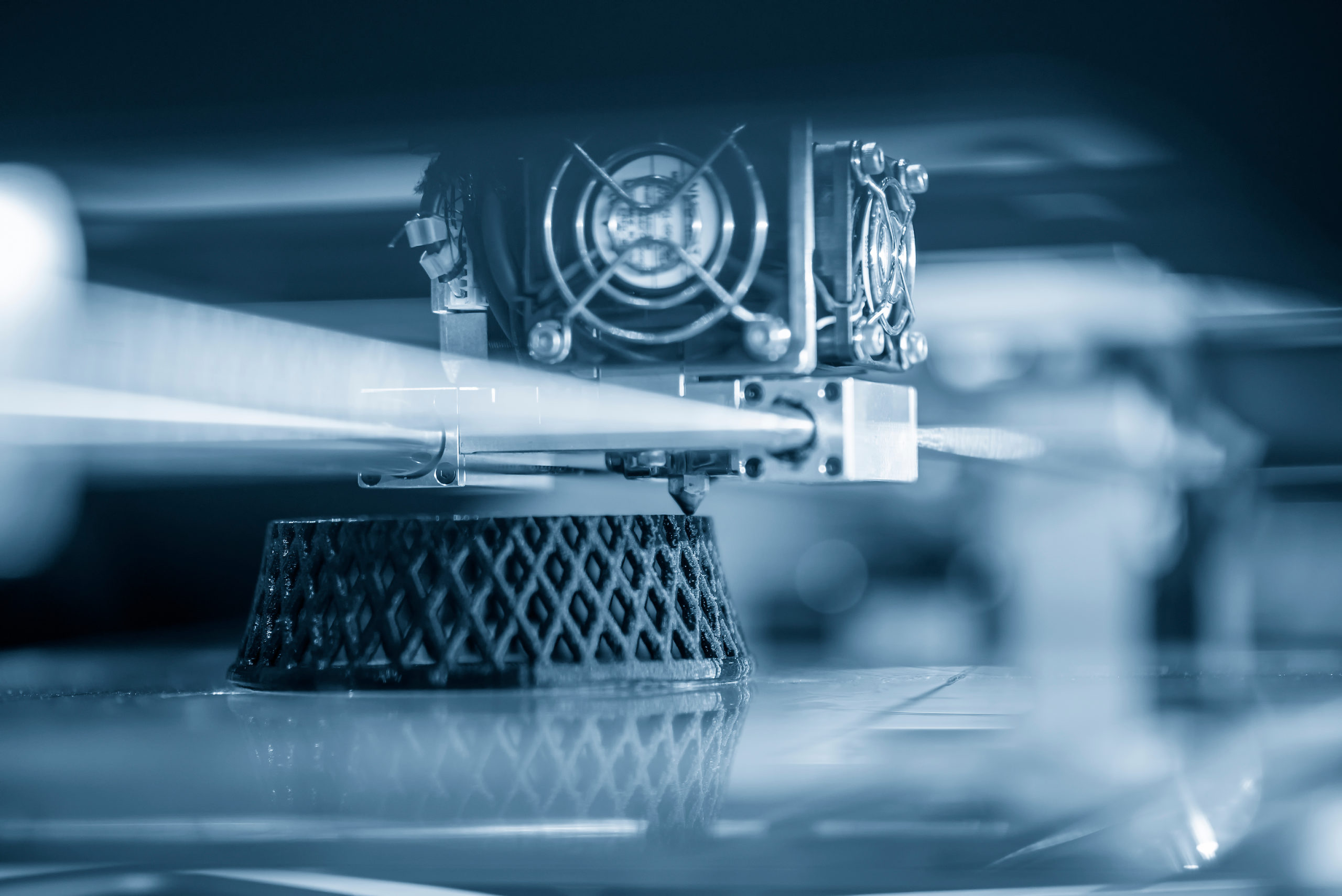 Monochrome image of 3d additive manufacturing producing a grid scaffold structure.