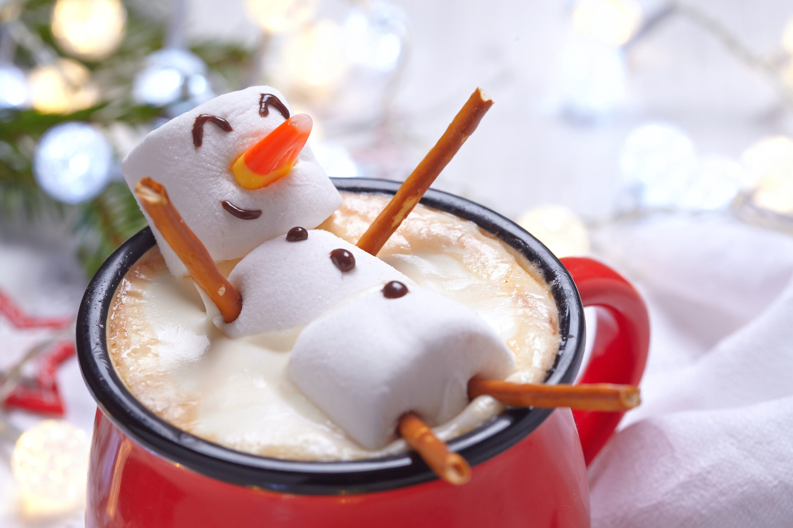 Marshmallow snowman on top of hot chocolate